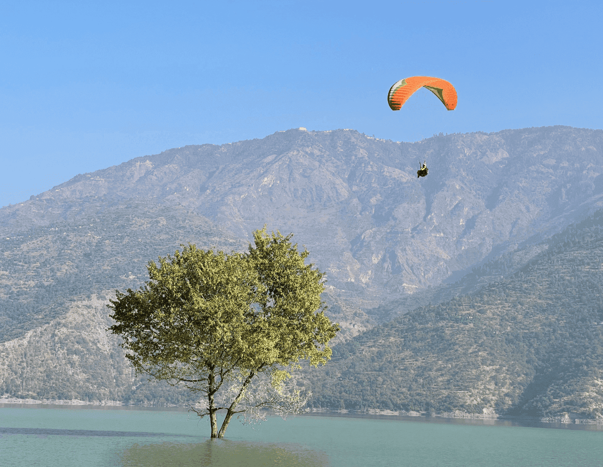Paragliding in Uttarakhand mountains with certified paragliding school instructors