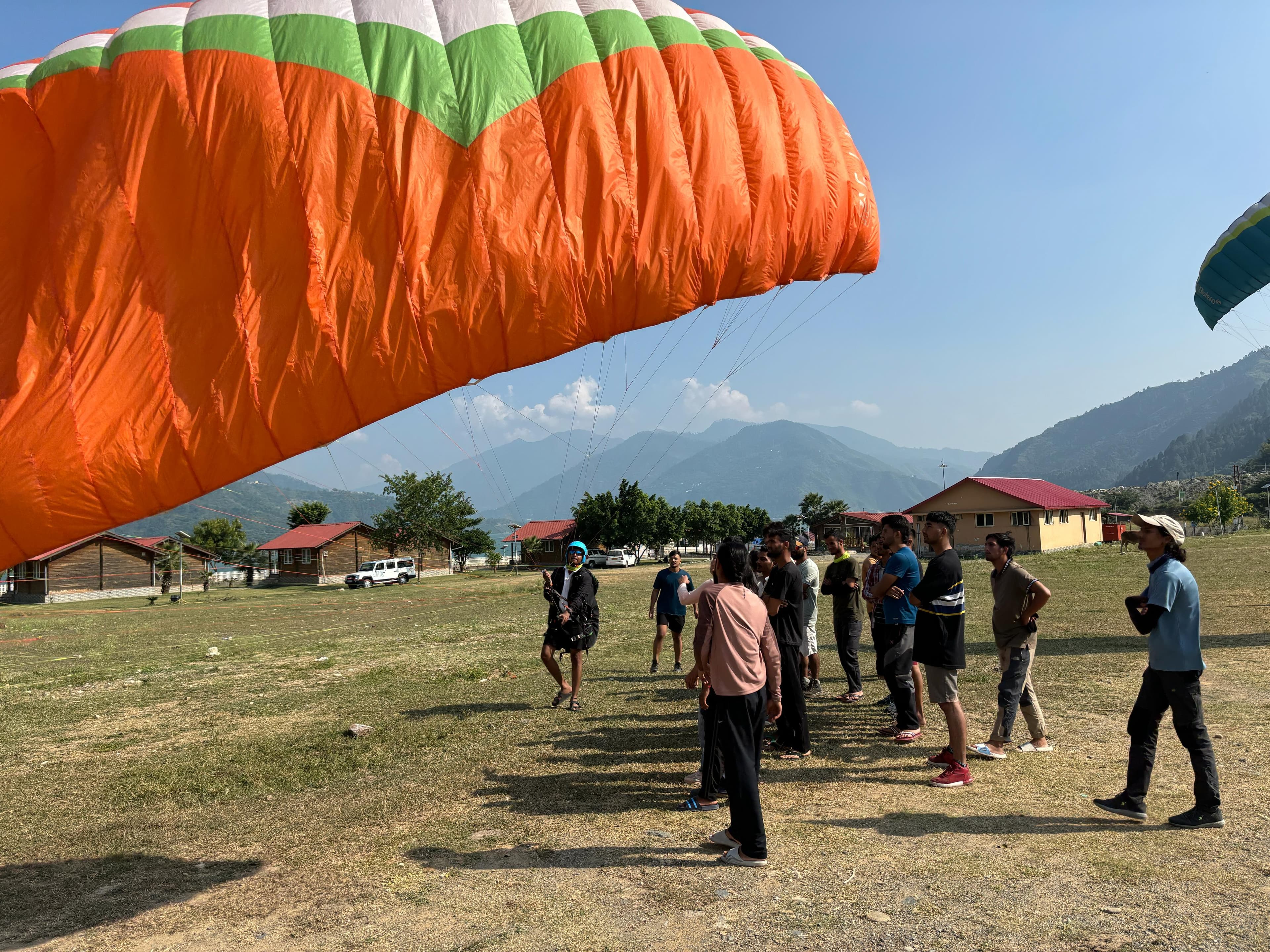 Acro paragliding wingover maneuver above Pawna Lake Kamshet