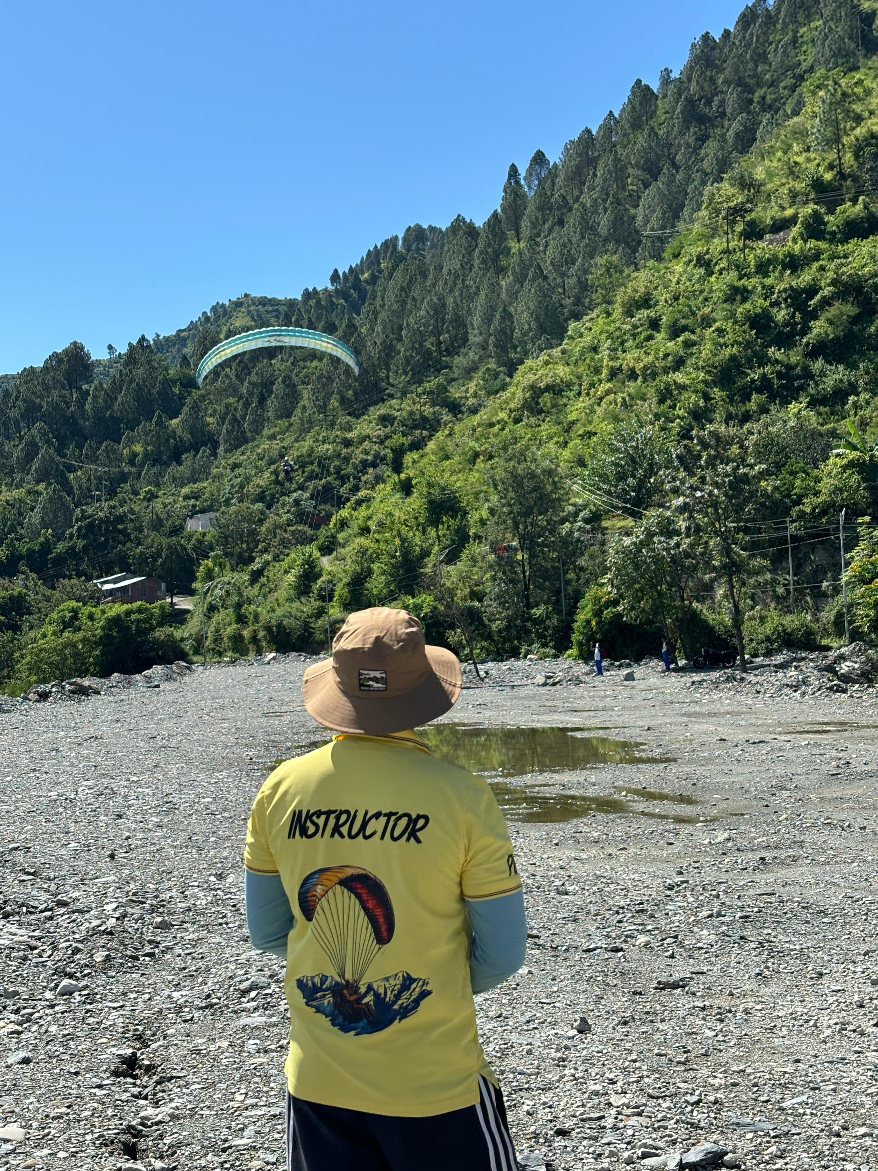 Students learning paragliding at training hill near Kamshet Pune