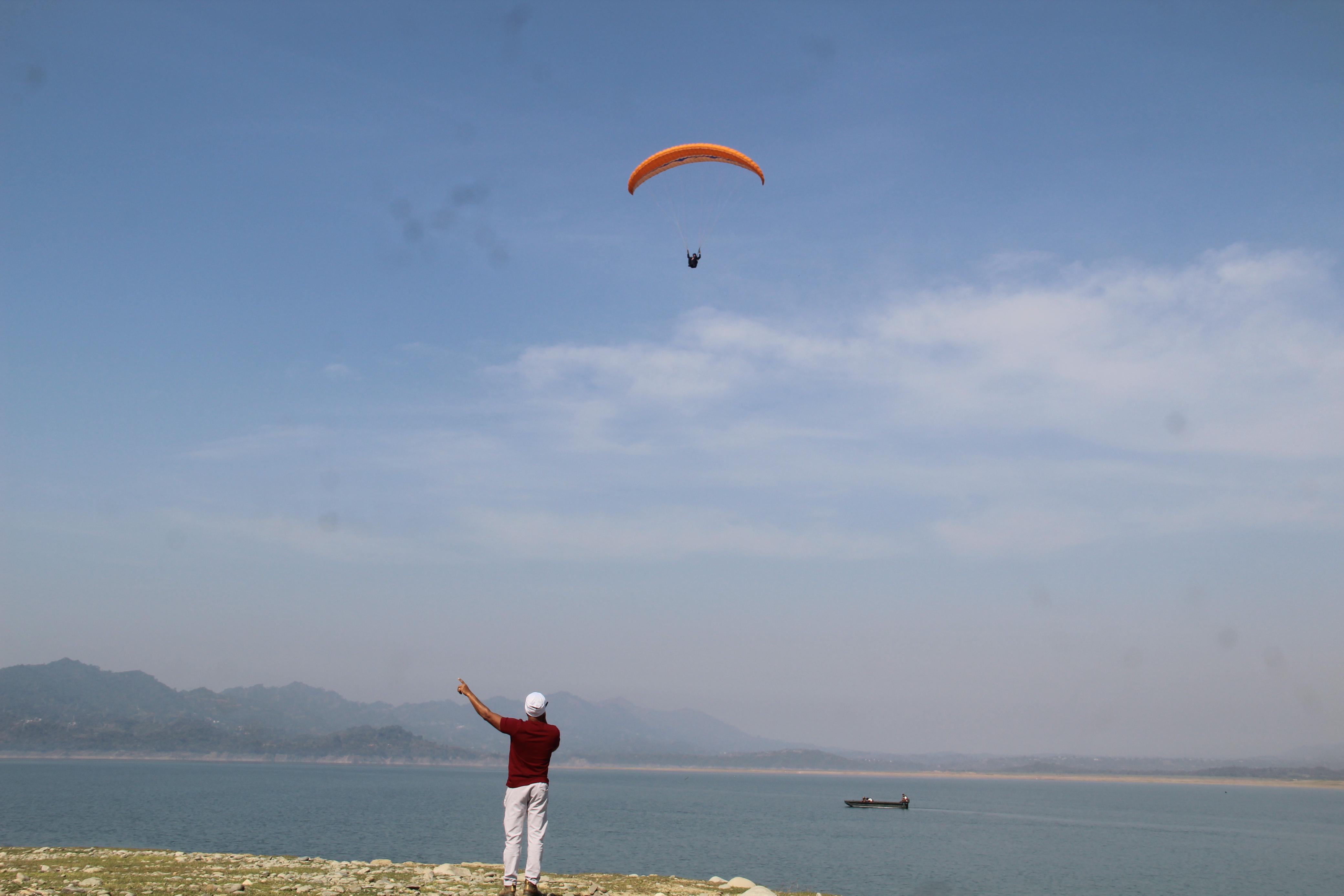 Paragliding pilots relaxing after flying sessions in Kamshet